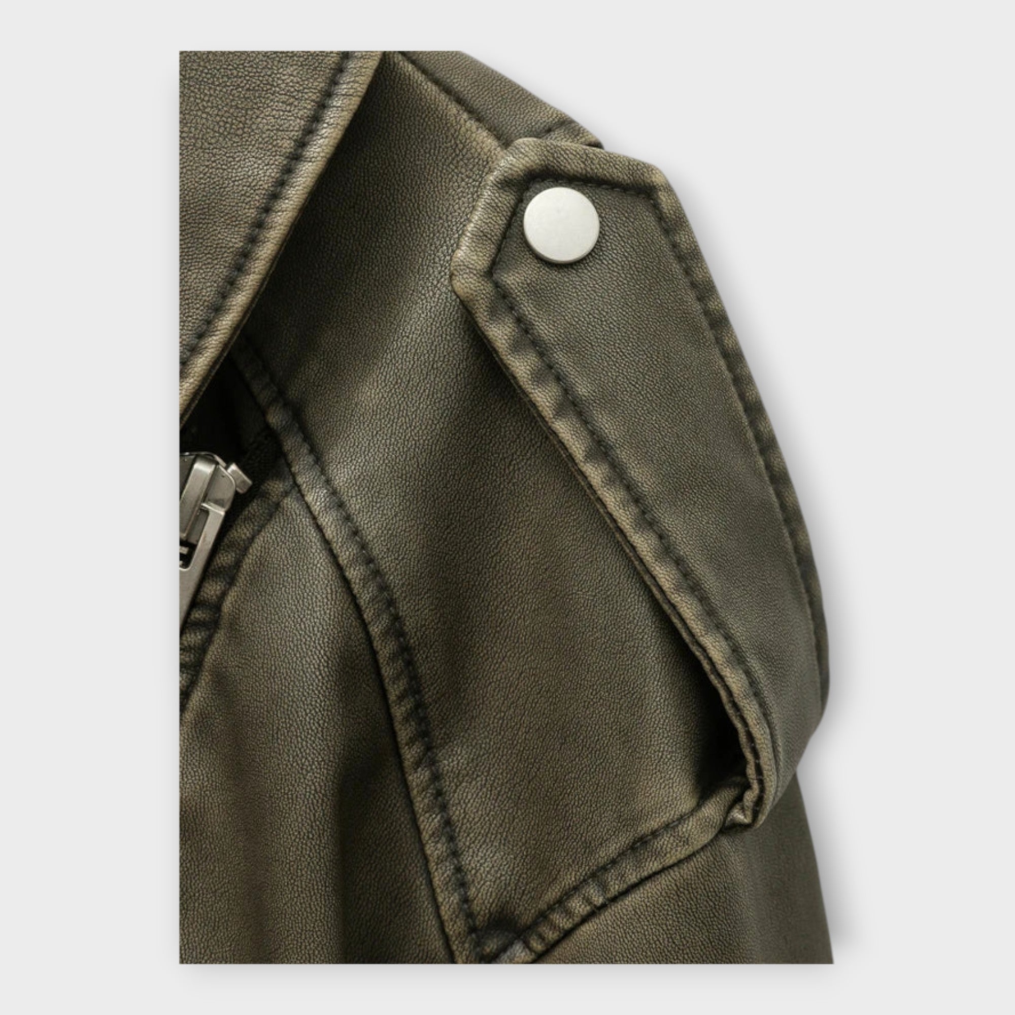 Moderna chaqueta corta de cuero con cinturón y estética sofisticada Luvamoda
